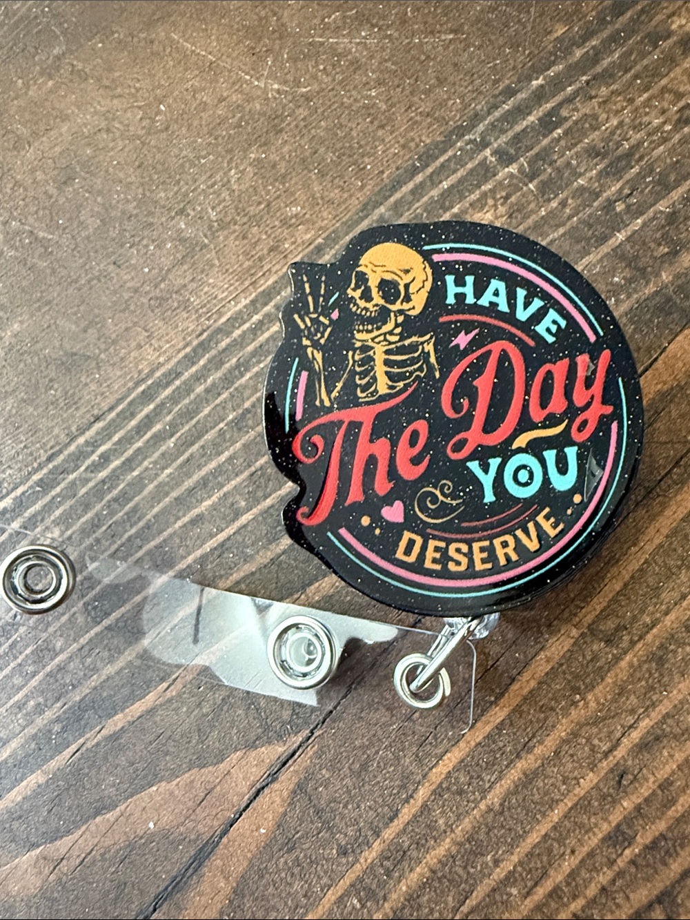 “Have The Day You Deserve” Badge Reel - Black with Red & Teal Accents